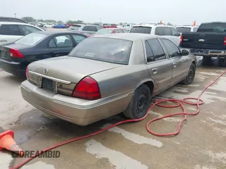 2006 Mercury Grand Marquis GS z VIN 2MEFM74VX6X655255, wystawiony jako IAAI lot #42261870 z przebiegiem Nie podano mil oraz . Historia ofert i sprzedaży dostępna na DreamBid. Obrazek 4.