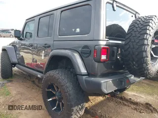 2019 Jeep Wrangler Unlimited Sahara with VIN 1C4HJXEG7KW661801, listed as a IAAI auction lot 40848731 with Not provided miles and . Bid and sale history available at DreamBid. Image 3.