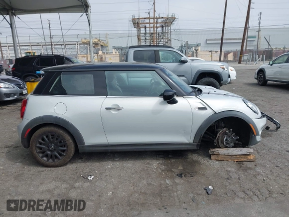 2021 MINI Hardtop Cooper with VIN WMWXR3C09M2N96671, listed as a IAAI auction lot 42031023 with 12,450 mi miles and . Bid and sale history available at DreamBid. Image 13.