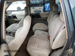 1995 Jeep Grand Cherokee Laredo with VIN 1J4FX58S8SC773884, listed as a Copart auction lot 56572555 with 424,126 mi miles and Salvage title. Bid and sale history available at DreamBid. Image 10.