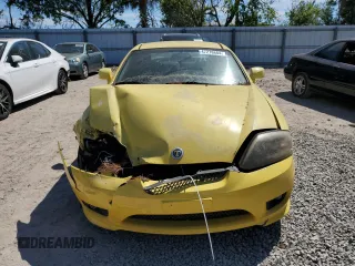 2006 Hyundai Tiburon GT z VIN KMHHN65F96U203308, wystawiony jako Copart lot #47278684 z przebiegiem 186 123 mil mil oraz Szkoda całkowita • Salvage title. Historia ofert i sprzedaży dostępna na DreamBid. Obrazek 5.