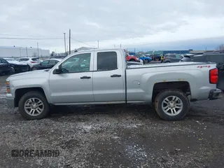2014 Chevrolet Silverado 1500 LT with VIN 1GCVKREC5EZ115459, listed as a IAAI auction lot 41143910 with 275,008 mi miles and . Bid and sale history available at DreamBid. Image 13.