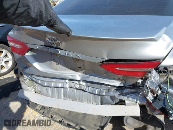 2019 Toyota Camry LE z VIN 4T1B11HK8KU681713, wystawiony jako IAAI lot #41823019 z przebiegiem 99 000 mil mil oraz . Historia ofert i sprzedaży dostępna na DreamBid. Obrazek 6.