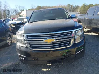 2015 Chevrolet Tahoe LTZ with VIN 1GNSKCKC3FR222135, listed as a IAAI auction lot 41816033 with 180,393 mi miles. Bid and sale history available at carsss.com. Image 12.