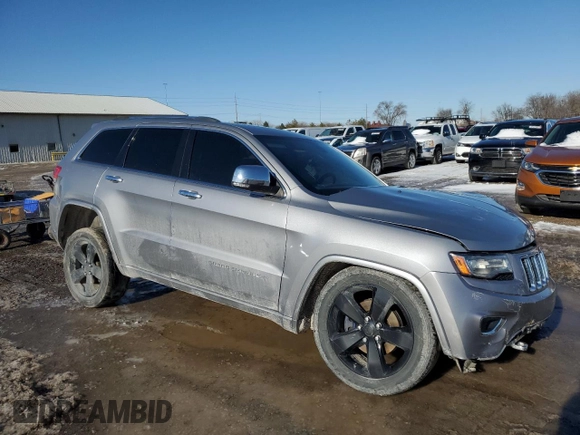 2014 Jeep Grand Cherokee Overland with VIN 1C4RJFCG2EC281062, listed as a Copart auction lot 47099225 with 127,660 mi miles and Salvage Title. Bid and sale history available at carsss.com. Image 4.