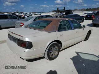 2003 Cadillac Seville Luxury SLS z VIN 1G6KS54Y03U289834, wystawiony jako Copart lot #77362694 z przebiegiem Nie podano mil oraz Szkoda całkowita • Salvage title. Historia ofert i sprzedaży dostępna na DreamBid. Obrazek 3.
