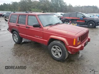 1999 Jeep Cherokee Sport with VIN 1J4FT68S1XL601799, listed as a Copart auction lot 83881844 with 203,572 mi miles and Salvage title. Bid and sale history available at DreamBid. Image 4.