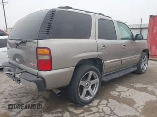 2003 GMC Yukon SLT with VIN 1GKEC13V33J287668, listed as a IAAI auction lot 41561108 with 326,719 mi miles. Bid and sale history available at carsss.com. Image 4.
