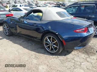 2021 Mazda MX-5 Miata Grand Touring с VIN JM1NDAD79M0457032, выставлен на аукционе IAAI как лот 41931348 с пробегом 47 874 миль миль и . История ставок и продаж доступна на DreamBid. Изображение 3.