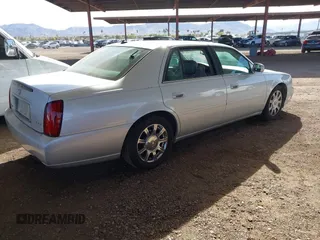 2003 Cadillac DeVille DTS z VIN 1G6KF57923U260229, wystawiony jako IAAI lot #41415468 z przebiegiem 58 012 mil mil oraz . Historia ofert i sprzedaży dostępna na DreamBid. Obrazek 4.