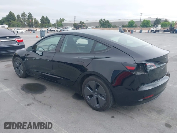 2023 Tesla Model 3 with VIN 5YJ3E1EA5PF647737, listed as a IAAI auction lot 42430145 with 20,525 mi miles and . Bid and sale history available at DreamBid. Image 3.