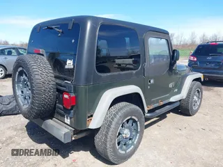 2006 Jeep Wrangler SE with VIN 1J4FA29116P763914, listed as a IAAI auction lot 42140140 with 107,161 mi miles. Bid and sale history available at carsss.com. Image 4.