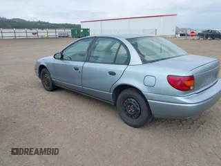2002 Saturn SL z VIN 1G8ZS52842Z289815, wystawiony jako IAAI lot #42557607 z przebiegiem 184 671 mil mil oraz . Historia ofert i sprzedaży dostępna na DreamBid. Obrazek 3.