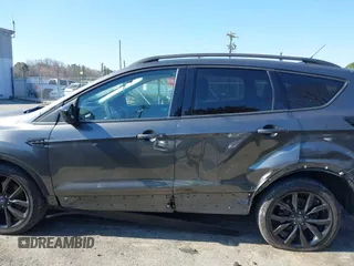 2017 Ford Escape SE with VIN 1FMCU9GD9HUC84906, listed as a IAAI auction lot 41762989 with 147,721 mi miles. Bid and sale history available at carsss.com. Image 14.