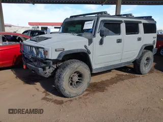 2003 Hummer H2 with VIN 5GRGN23U13H128617, listed as a IAAI auction lot 41494349 with 135,295 mi miles. Bid and sale history available at carsss.com. Image 2.