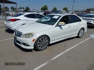 2009 Mercedes-Benz C-Class 3.0L Sport with VIN WDDGF54X09F233877, listed as a IAAI auction lot 42121123 with 215,698 mi miles. Bid and sale history available at carsss.com. Image 2.
