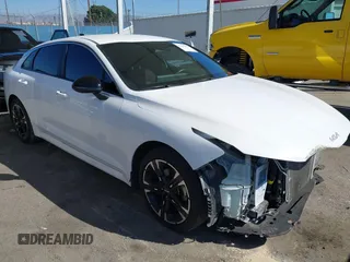 2023 Kia K5 GT-Line z VIN 5XXG64J22PG224092, wystawiony jako IAAI lot #41652803 z przebiegiem 50 326 mil mil oraz . Historia ofert i sprzedaży dostępna na DreamBid. Obrazek 1.