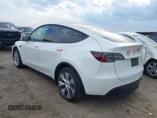 2023 Tesla Model Y Long Range with VIN 7SAYGDEE2PF765395, listed as a IAAI auction lot 41688080 with 27,792 mi miles and . Bid and sale history available at DreamBid. Image 3.
