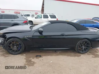 2014 BMW M6 z VIN WBSLZ9C58ED651156, wystawiony jako IAAI lot #41526192 z przebiegiem 90 642 mil mil oraz . Historia ofert i sprzedaży dostępna na DreamBid. Obrazek 14.