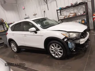2015 Mazda CX-5 Grand Touring with VIN JM3KE4DY4F0495627, listed as a IAAI auction lot 41887773 with 130,421 mi miles. Bid and sale history available at carsss.com. Image 14.