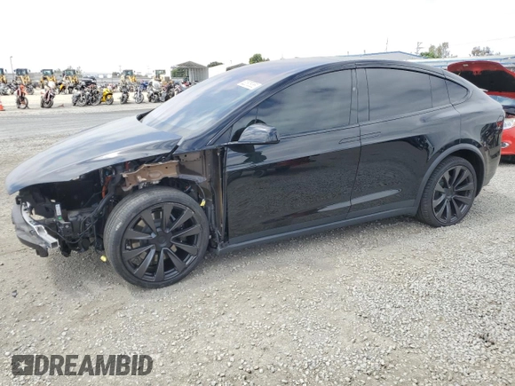 2022 Tesla Model X with VIN 7SAXCDE59NF360610, listed as a Copart auction lot 52575365 with 51,557 mi miles and Salvage Title. Bid and sale history available at carsss.com. Image 1.