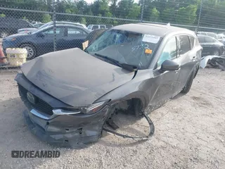 2018 Mazda CX-5 Grand Touring z VIN JM3KFADM5J1365772, wystawiony jako IAAI lot #42251805 z przebiegiem 44 599 mil mil oraz . Historia ofert i sprzedaży dostępna na DreamBid. Obrazek 2.
