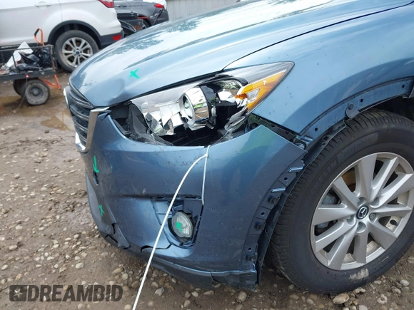 2016 Mazda CX-5 Touring z VIN JM3KE2CY3G0728968, wystawiony jako IAAI lot #42189174 z przebiegiem 145 977 mil mil oraz . Historia ofert i sprzedaży dostępna na DreamBid. Obrazek 6.