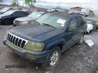 2003 Jeep Grand Cherokee Laredo with VIN 1J4GW48S63C591605, listed as a IAAI auction lot 41973681 with 177,024 mi miles and . Bid and sale history available at DreamBid. Image 2.