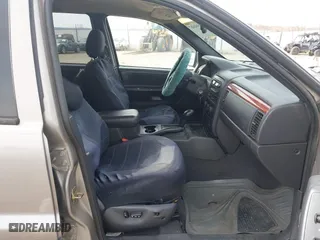 1999 Jeep Grand Cherokee Laredo with VIN 1J4GW58S6XC613307, listed as a IAAI auction lot 41592687 with 264,176 mi miles. Bid and sale history available at carsss.com. Image 5.
