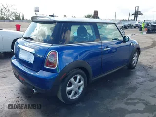 2009 MINI Hardtop with VIN WMWMF335X9TW71208, listed as a IAAI auction lot 41535653 with 148,660 mi miles and . Bid and sale history available at DreamBid. Image 4.
