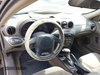 2004 Pontiac Grand Am SE z VIN 1G2NE52F64C108508, wystawiony jako IAAI lot #42143643 z przebiegiem 126 693 mil mil oraz . Historia ofert i sprzedaży dostępna na DreamBid. Obrazek 13.