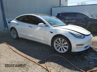 2020 Tesla Model 3 Standard Range Plus with VIN 5YJ3E1EA6LF661513, listed as a Copart auction lot 47008985 with 128,362 mi miles and Non Repairable. Bid and sale history available at DreamBid. Image 4.