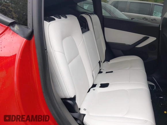 2021 Tesla Model Y Long Range with VIN 5YJYGDEE5MF085032, listed as a IAAI auction lot 41982925 with 64,541 mi miles and . Bid and sale history available at DreamBid. Image 8.