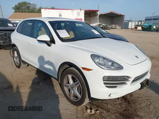 2014 Porsche Cayenne with VIN WP1AA2A23ELA97180, listed as a IAAI auction lot 42072423 with 143,374 mi miles and . Bid and sale history available at DreamBid. Image 1.