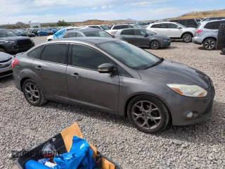 2013 Ford Focus SE with VIN 1FADP3F24DL189897, listed as a Copart auction lot 61970155 with 212,218 mi miles and Salvage title. Bid and sale history available at DreamBid. Image 4.