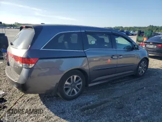 2014 Honda Odyssey Touring z VIN 5FNRL5H90EB007862, wystawiony jako Copart lot #60470005 z przebiegiem 135 686 mil mil oraz Czysty tytuł • Clean title. Historia ofert i sprzedaży dostępna na DreamBid. Obrazek 3.