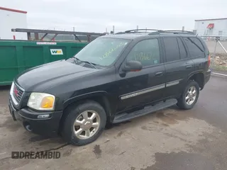 2002 GMC Envoy SLT with VIN 1GKDT13S222143135, listed as a IAAI auction lot 42136672 with 206,064 mi miles. Bid and sale history available at carsss.com. Image 2.
