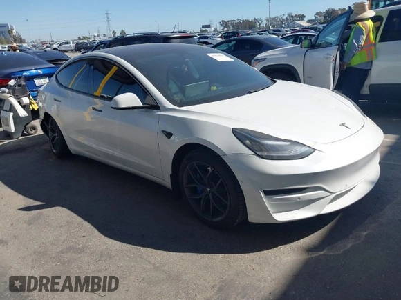 2020 Tesla Model 3 Standard Range Plus with VIN 5YJ3E1EA1LF659765, listed as a IAAI auction lot 41834411 with 42,433 mi miles and . Bid and sale history available at carsss.com. Image 1.