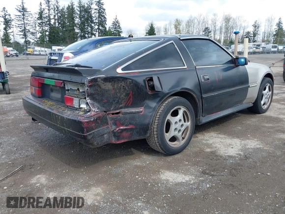 1986 Nissan 300ZX z VIN JN1HZ14S4GX140955, wystawiony jako IAAI lot #41935505 z przebiegiem 144 917 mil mil oraz . Historia ofert i sprzedaży dostępna na DreamBid. Obrazek 4.