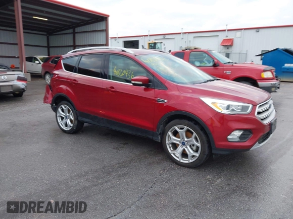 2019 Ford Escape Titanium z VIN 1FMCU9J99KUA18880, wystawiony jako IAAI lot #40830436 z przebiegiem 117 499 mil mil oraz . Historia ofert i sprzedaży dostępna na DreamBid. Obrazek 1.