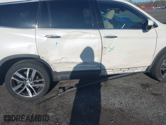 2017 Honda Pilot Elite with VIN 5FNYF6H00HB032386, listed as a IAAI auction lot 41976702 with 153,251 mi miles and . Bid and sale history available at DreamBid. Image 6.