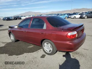 2001 Kia Sephia z VIN KNAFB121015028494, wystawiony jako Copart lot #81581404 z przebiegiem 86 655 mil mil oraz Szkody całkowita. Historia ofert i sprzedaży dostępna na DreamBid. Obrazek 2.