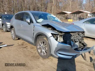 2021 Mazda CX-5 Grand Touring with VIN JM3KFADM7M1328341, listed as a IAAI auction lot 41660906 with 109,417 mi miles. Bid and sale history available at carsss.com. Image 1.