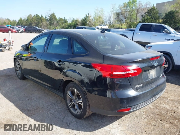 2016 Ford Focus SE with VIN 1FADP3FE7GL202284, listed as a IAAI auction lot 42014457 with 130,000 mi miles. Bid and sale history available at carsss.com. Image 3.