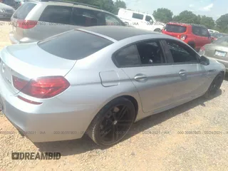 2015 BMW 6 Series 640i z VIN WBA6A0C57FGB53750, wystawiony jako IAAI lot #30357803 z przebiegiem 59 462 mil mil oraz . Historia ofert i sprzedaży dostępna na DreamBid. Obrazek 4.