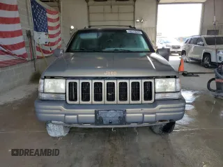 1998 Jeep Grand Cherokee Limited with VIN 1J4GZ78Y8WC285670, listed as a Copart auction lot 70213044 with 128,382 mi miles and Clean Title. Bid and sale history available at carsss.com. Image 5.