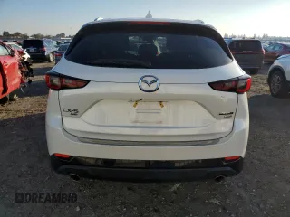2022 Mazda CX-5 2.5 Turbo with VIN JM3KFBAY7N0597010, listed as a Copart auction lot 83062114 with 18,136 mi miles and Salvage Title. Bid and sale history available at carsss.com. Image 6.