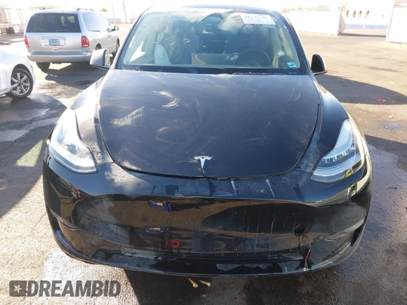 2023 Tesla Model Y Long Range with VIN 7SAYGDEE8PA151965, listed as a IAAI auction lot 41343497 with 25,869 mi miles. Bid and sale history available at carsss.com. Image 6.