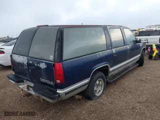 1994 Chevrolet Suburban with VIN 1GNEC16K3RJ360549, listed as a IAAI auction lot 42080890 with 126,804 mi miles. Bid and sale history available at carsss.com. Image 4.