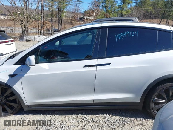 2023 Tesla Model X with VIN 7SAXCDE54PF430808, listed as a IAAI auction lot 41667924 with 21,100 mi miles and . Bid and sale history available at DreamBid. Image 14.